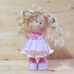 doll with white hair and pink dress